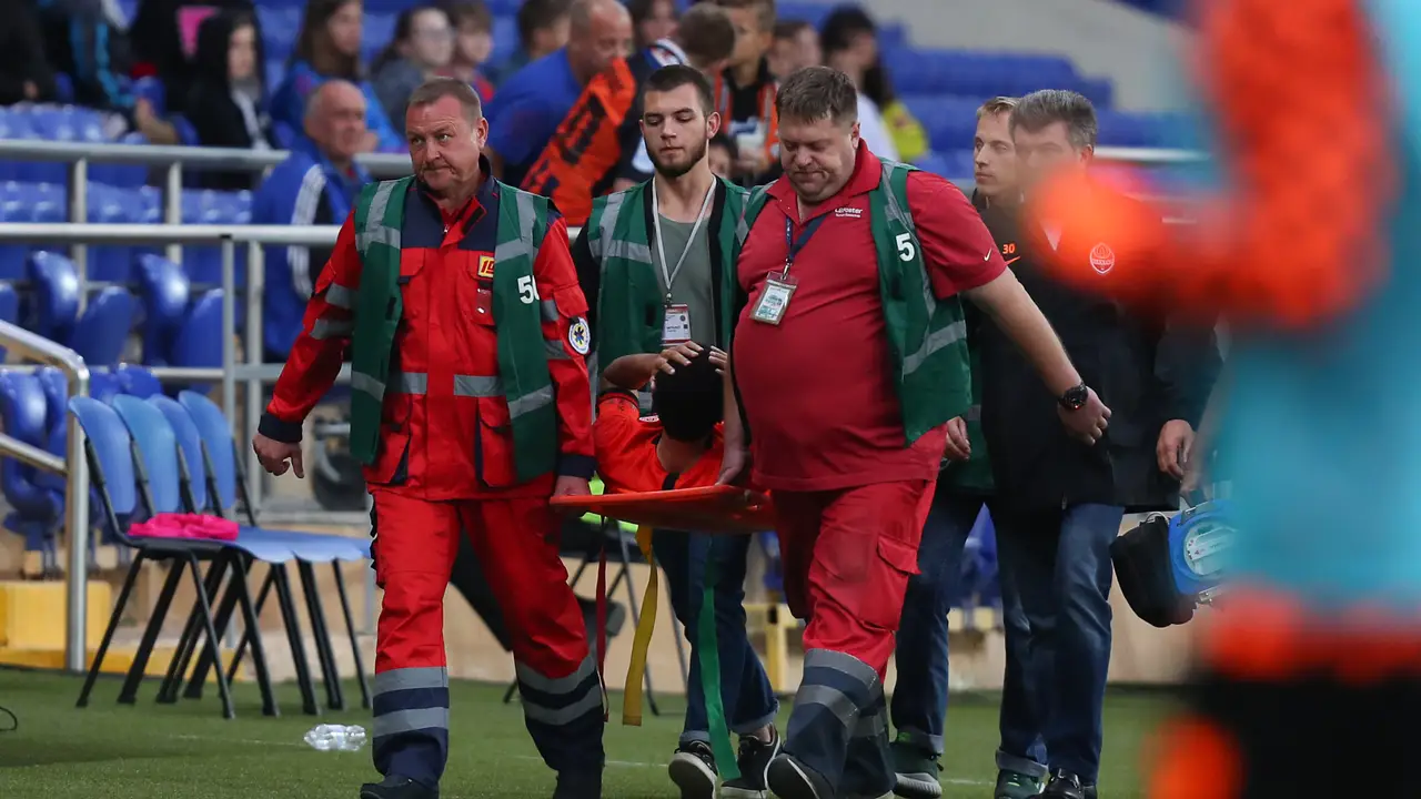 SEPTEMBER 14, 2019 - KHARKIV, UKRAINE: Captain Taison Barcellos Freda gets terrible concussion of the brain injury. Ukrainian Premier League. Geting help from FC Shakhtar Donetsk doctors on stretchers